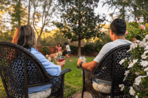 Couple sitting outside enjoying their yard